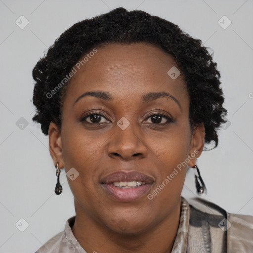 Joyful black adult female with short  brown hair and brown eyes