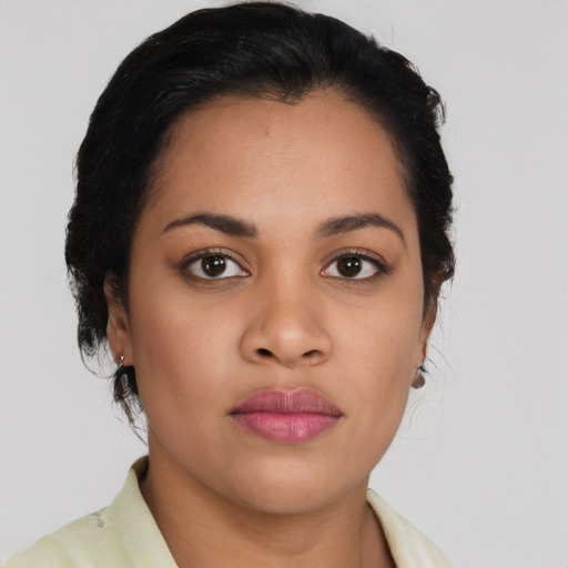 Neutral latino young-adult female with long  black hair and brown eyes