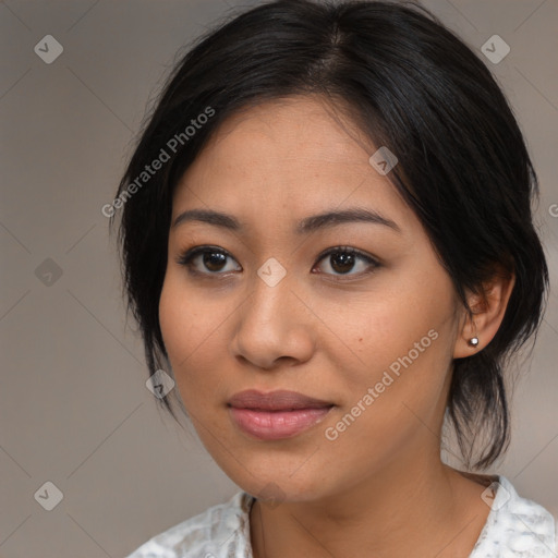 Joyful asian young-adult female with medium  black hair and brown eyes