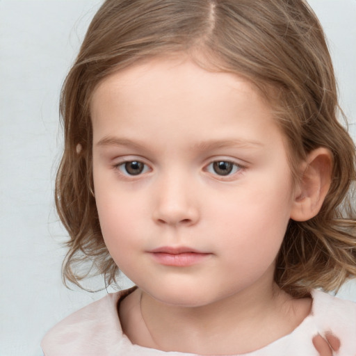 Neutral white child female with medium  brown hair and brown eyes