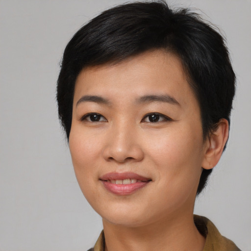 Joyful asian young-adult female with short  black hair and brown eyes