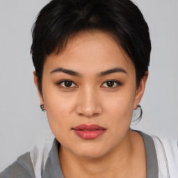 Joyful asian young-adult female with short  black hair and brown eyes