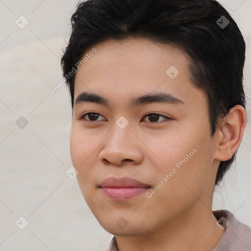 Joyful asian young-adult male with short  black hair and brown eyes