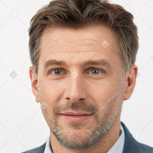 Joyful white adult male with short  brown hair and brown eyes