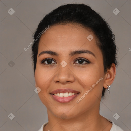 Joyful latino young-adult female with short  brown hair and brown eyes