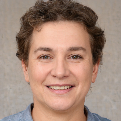 Joyful white adult female with short  brown hair and brown eyes