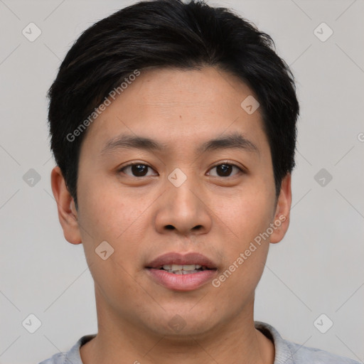 Joyful asian young-adult male with short  brown hair and brown eyes