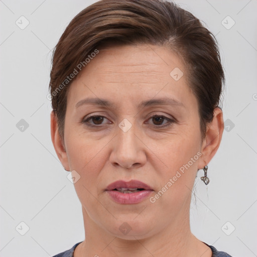 Joyful white adult female with short  brown hair and brown eyes