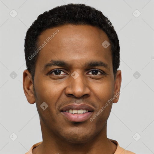 Joyful black young-adult male with short  black hair and brown eyes