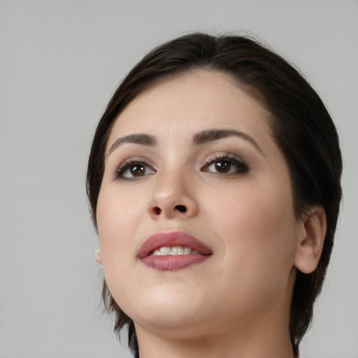 Neutral white young-adult female with medium  black hair and brown eyes