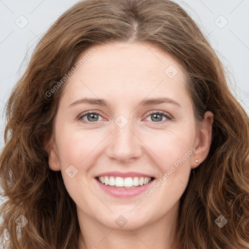 Joyful white young-adult female with long  brown hair and green eyes