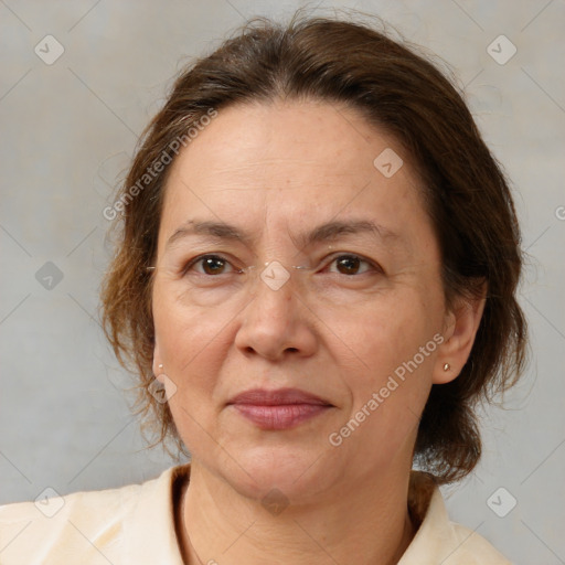 Joyful white adult female with medium  brown hair and brown eyes