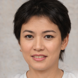 Joyful asian young-adult female with short  brown hair and brown eyes