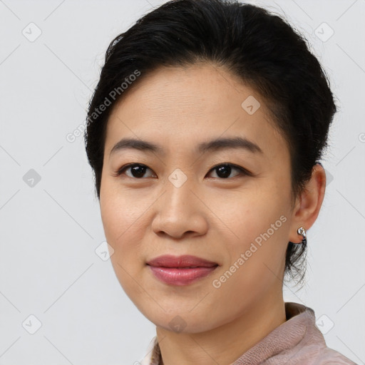 Joyful asian young-adult female with short  brown hair and brown eyes