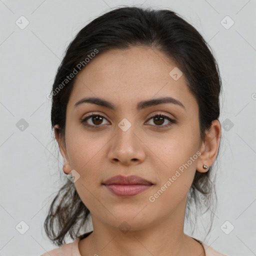 Joyful latino young-adult female with medium  brown hair and brown eyes