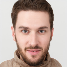 Joyful white young-adult male with short  brown hair and brown eyes