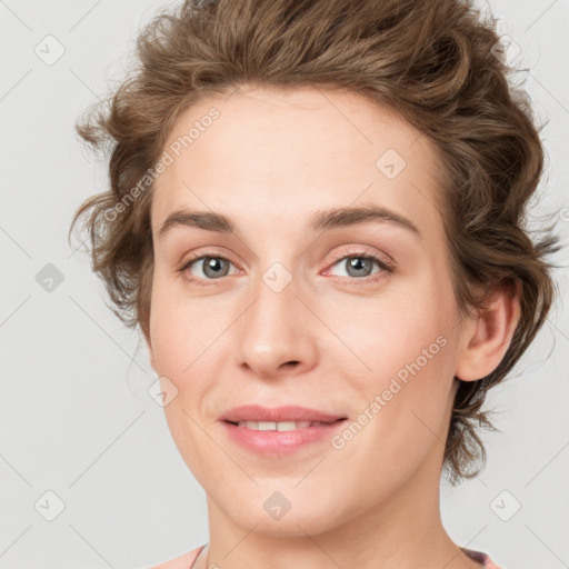 Joyful white young-adult female with medium  brown hair and blue eyes