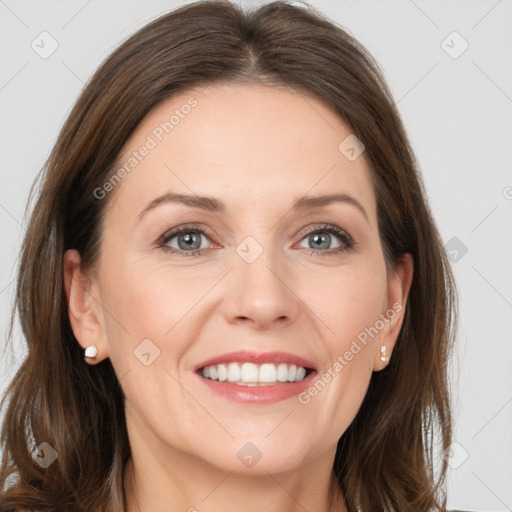 Joyful white young-adult female with long  brown hair and grey eyes