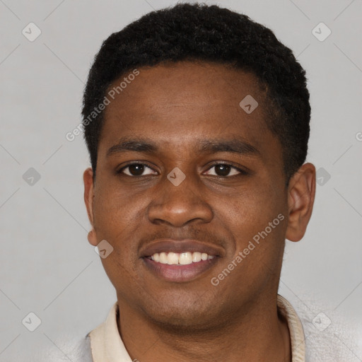 Joyful black young-adult male with short  black hair and brown eyes