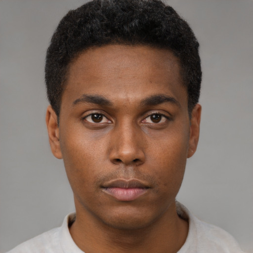 Neutral black young-adult male with short  brown hair and brown eyes