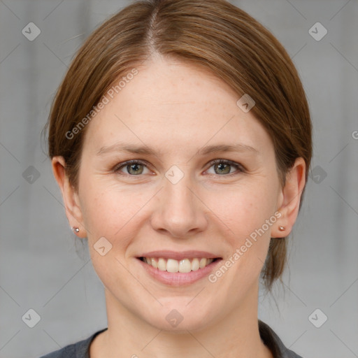 Joyful white young-adult female with medium  brown hair and grey eyes