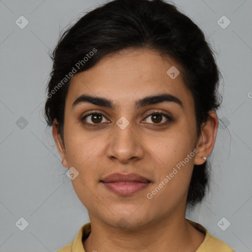 Joyful latino young-adult female with medium  brown hair and brown eyes