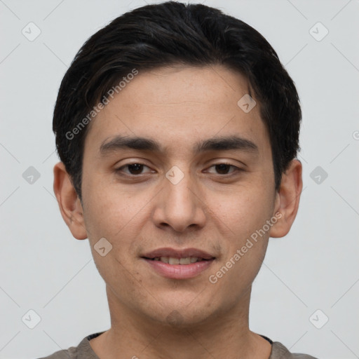 Joyful white young-adult male with short  black hair and brown eyes