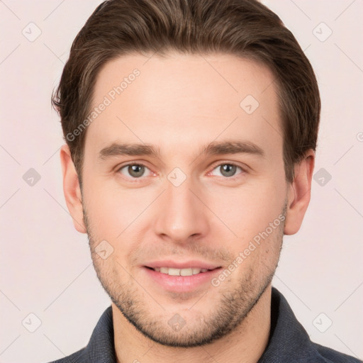 Joyful white young-adult male with short  brown hair and grey eyes