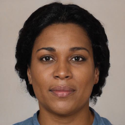 Neutral black adult female with medium  black hair and brown eyes