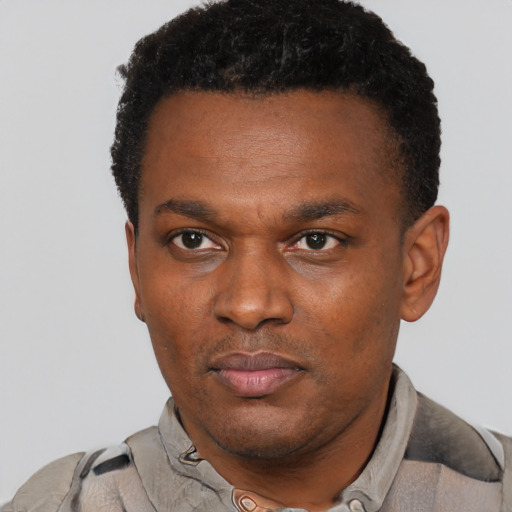 Neutral latino adult male with short  black hair and brown eyes