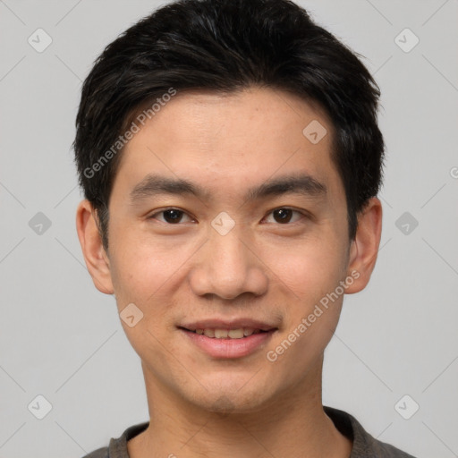 Joyful white young-adult male with short  black hair and brown eyes