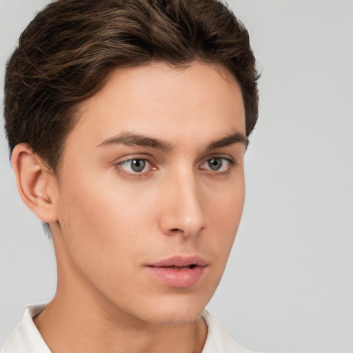 Neutral white young-adult male with short  brown hair and brown eyes