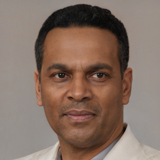 Neutral latino adult male with short  black hair and brown eyes