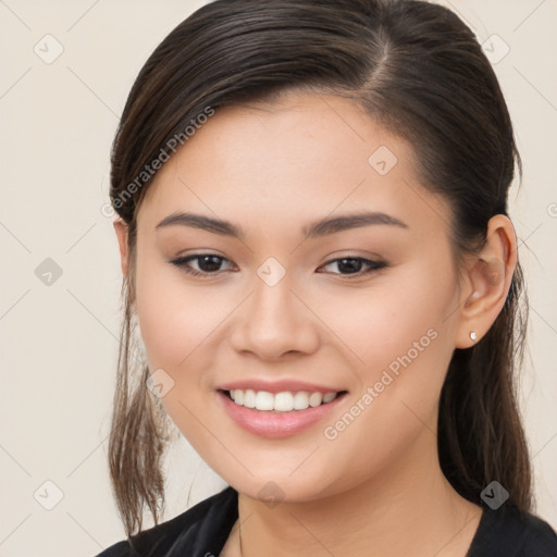 Joyful white young-adult female with long  brown hair and brown eyes