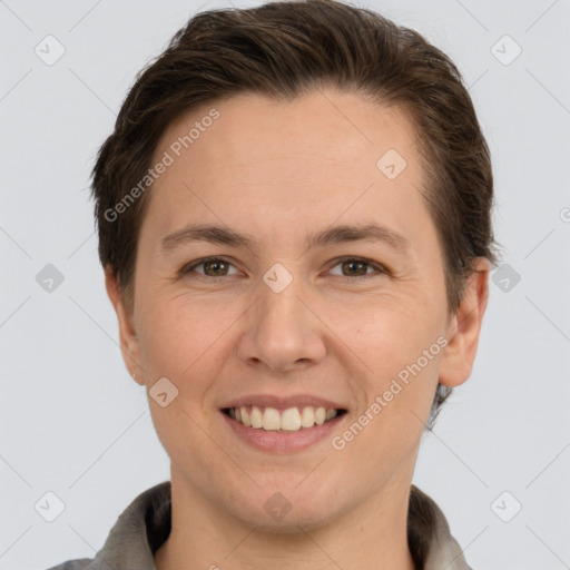 Joyful white young-adult female with short  brown hair and grey eyes