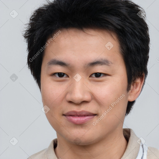 Joyful asian young-adult male with short  brown hair and brown eyes