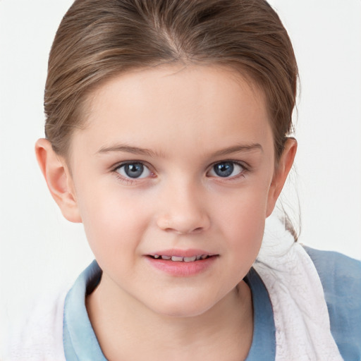 Joyful white child female with short  brown hair and blue eyes