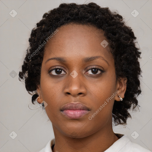 Neutral black young-adult female with medium  brown hair and brown eyes