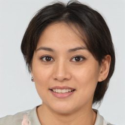 Joyful white young-adult female with medium  brown hair and brown eyes