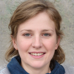 Joyful white young-adult female with medium  brown hair and blue eyes