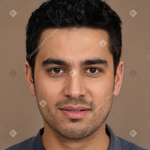 Joyful white young-adult male with short  black hair and brown eyes