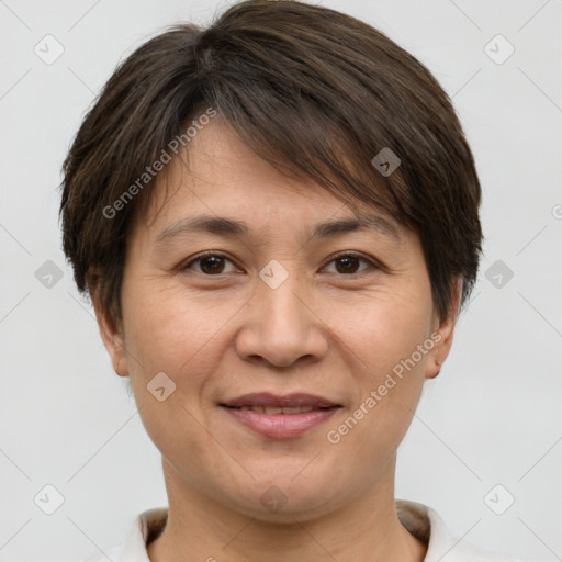 Joyful white adult female with short  brown hair and brown eyes