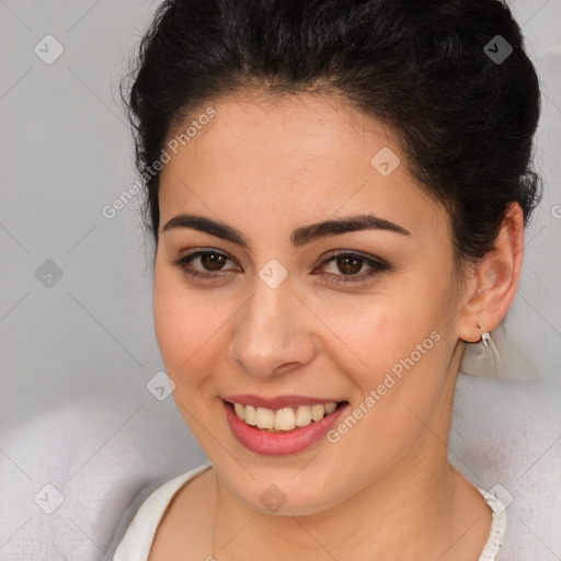 Joyful latino young-adult female with short  brown hair and brown eyes