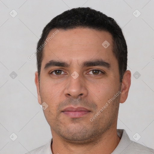 Neutral white young-adult male with short  black hair and brown eyes