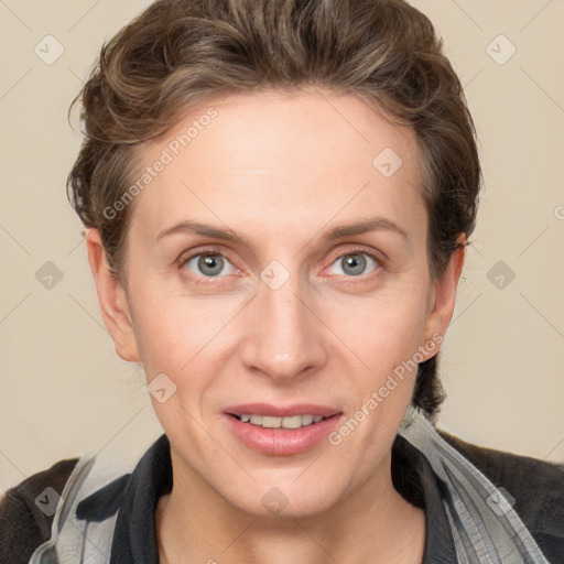 Joyful white adult female with short  brown hair and grey eyes