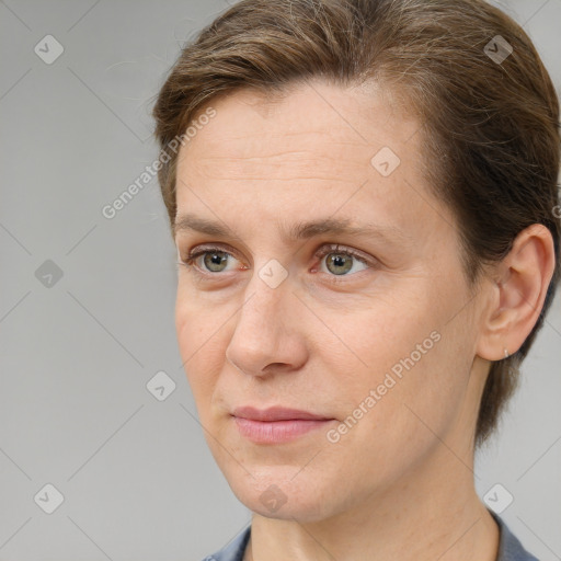 Joyful white adult female with short  brown hair and brown eyes