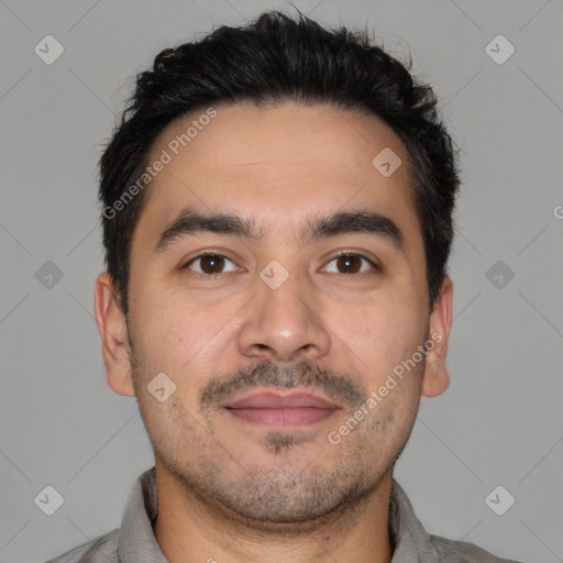 Joyful white young-adult male with short  black hair and brown eyes