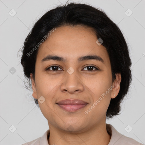 Joyful latino young-adult female with medium  brown hair and brown eyes