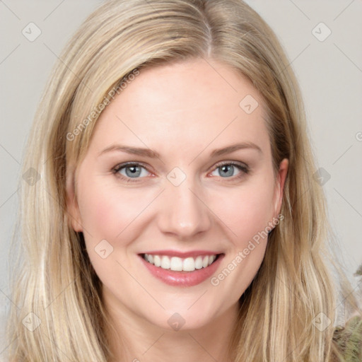 Joyful white young-adult female with long  brown hair and blue eyes