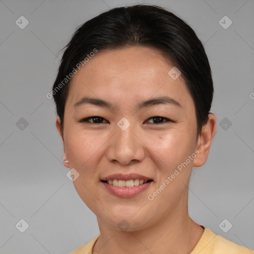 Joyful asian young-adult female with short  brown hair and brown eyes